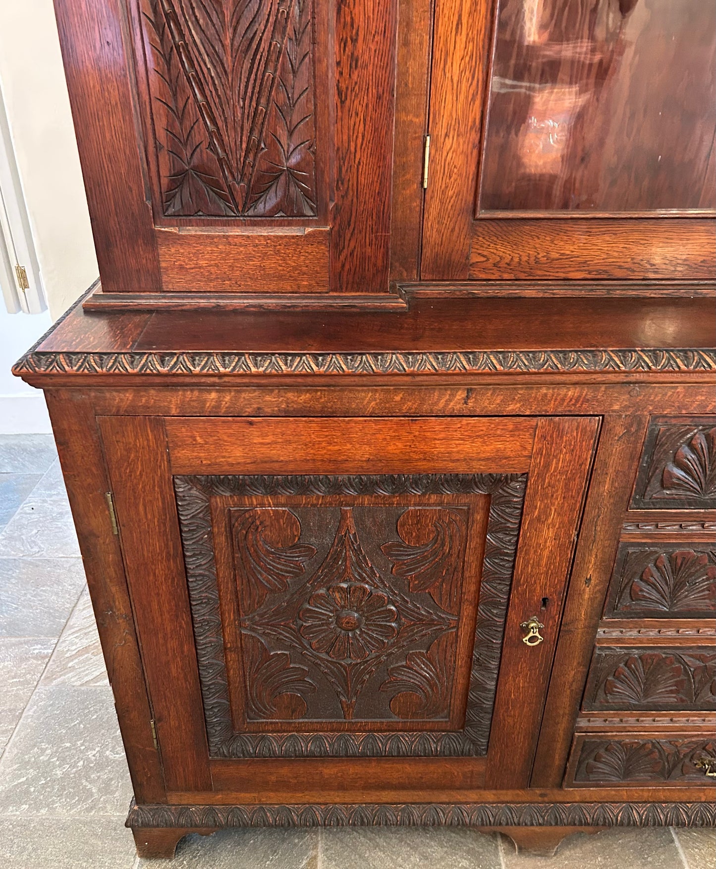 Large oak bookcase on carved cupboard base