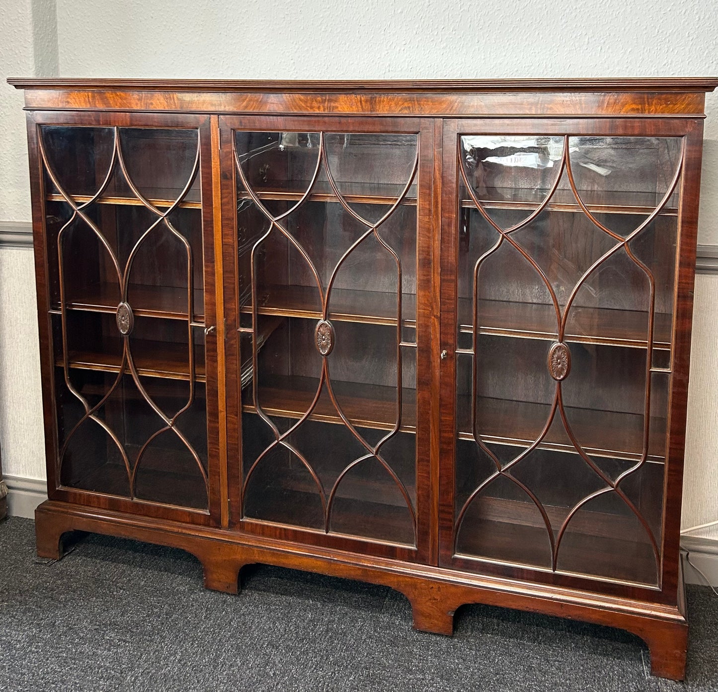 Mahogany 3 door glazed bookcase by Wylie and Lochhead