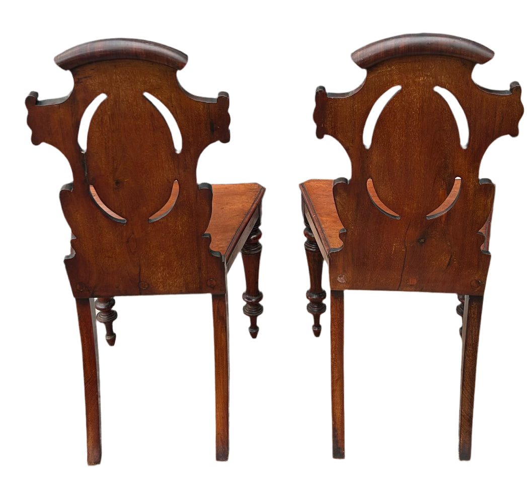 Pair of Victorian mahogany hall chairs