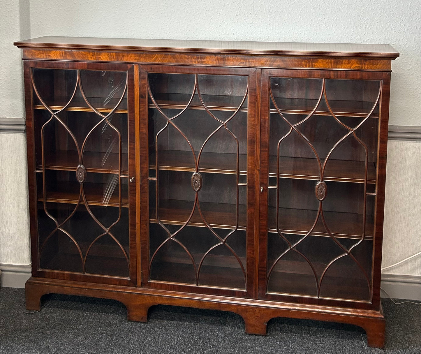 Mahogany 3 door glazed bookcase by Wylie and Lochhead