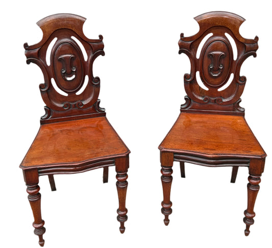 Pair of Victorian mahogany hall chairs