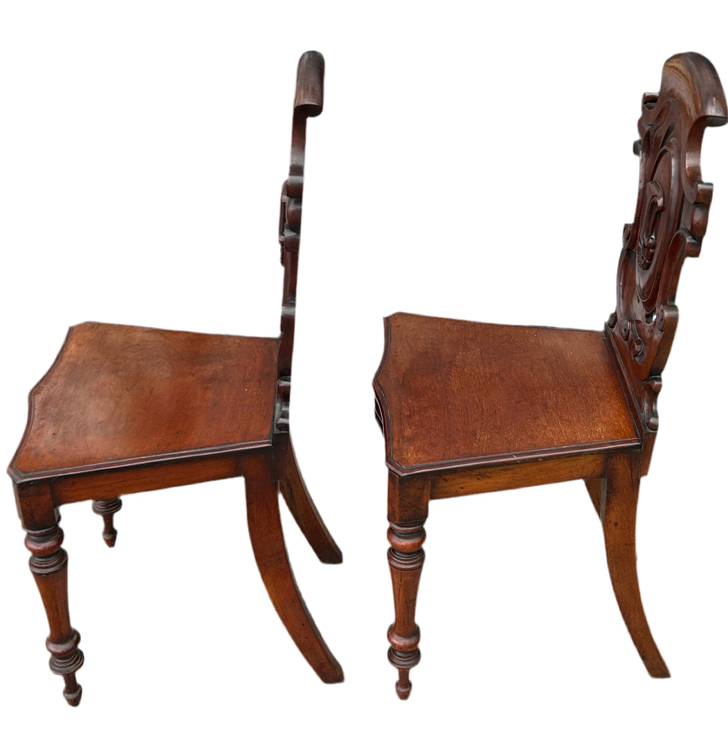 Pair of Victorian mahogany hall chairs