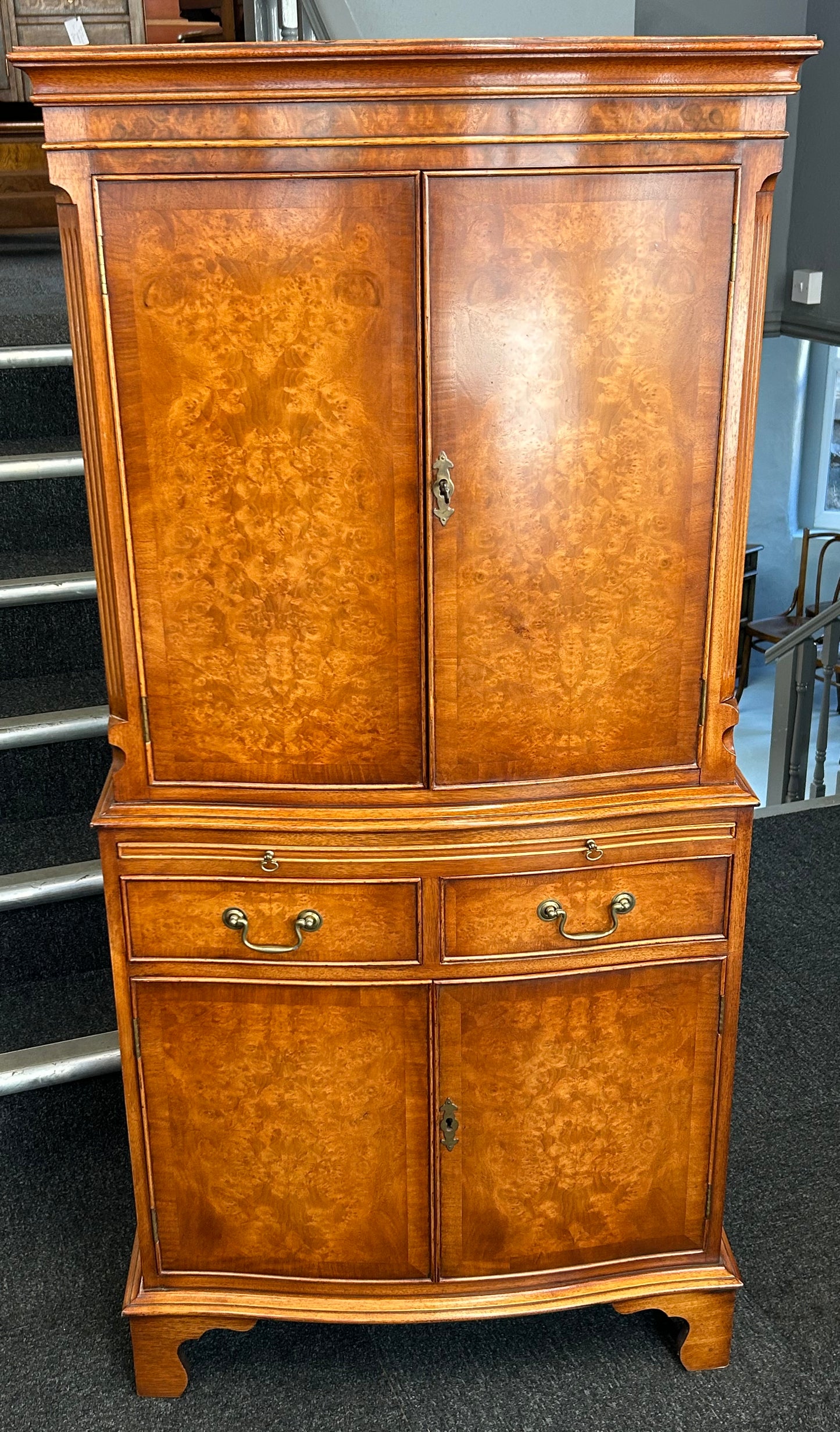 A Bevan Funnell Reprodux Burr Walnut Dinks Cabinet