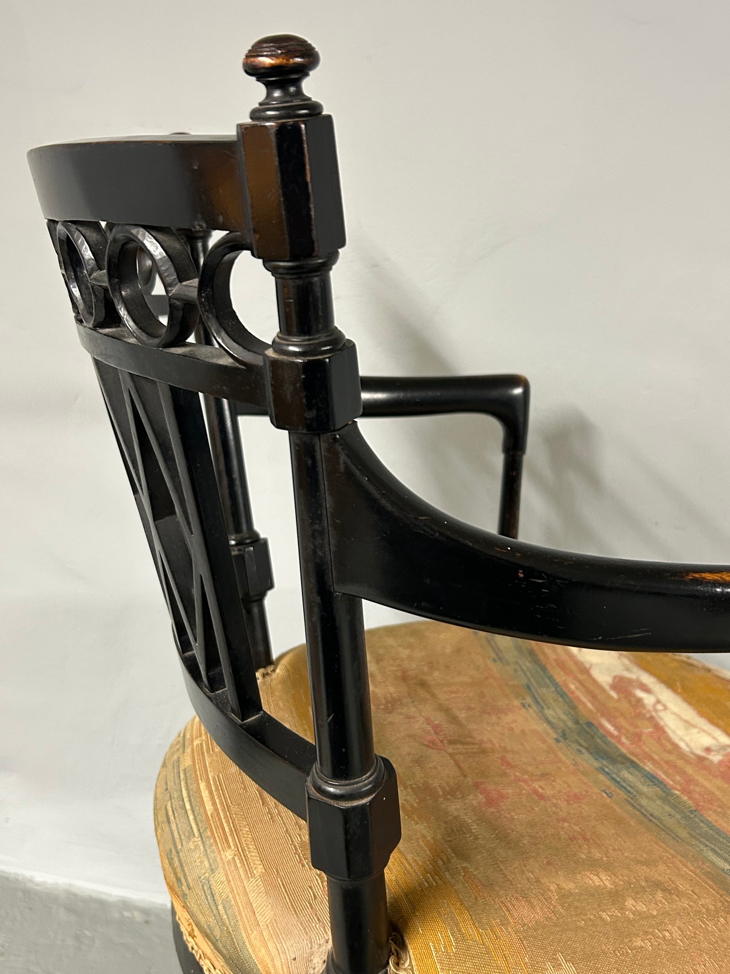 Collier and Plucknett ebonised aesthetic movement armchair.