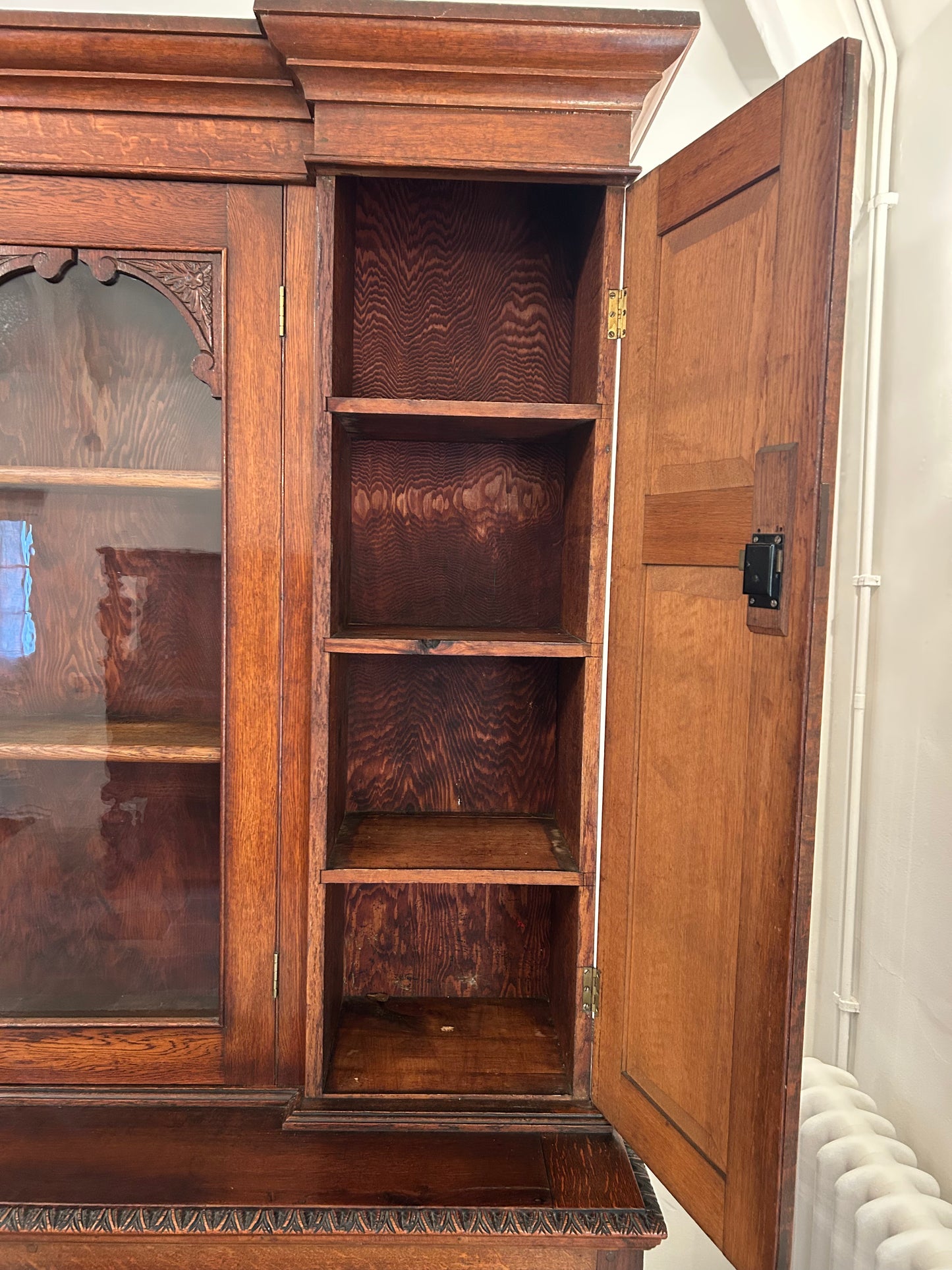 Large oak bookcase on carved cupboard base