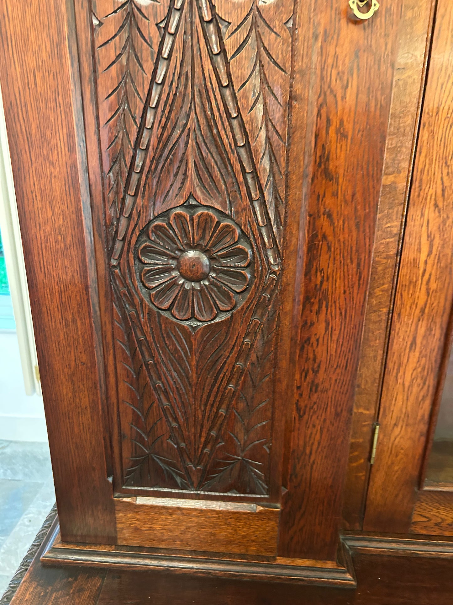 Large oak bookcase on carved cupboard base