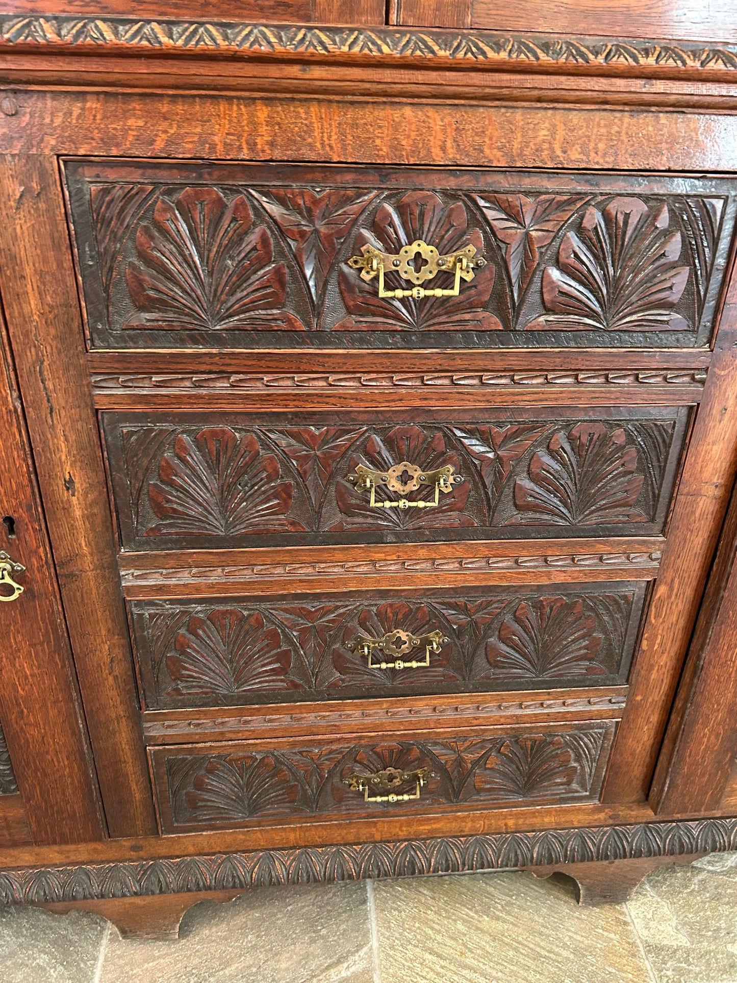 Large oak bookcase on carved cupboard base