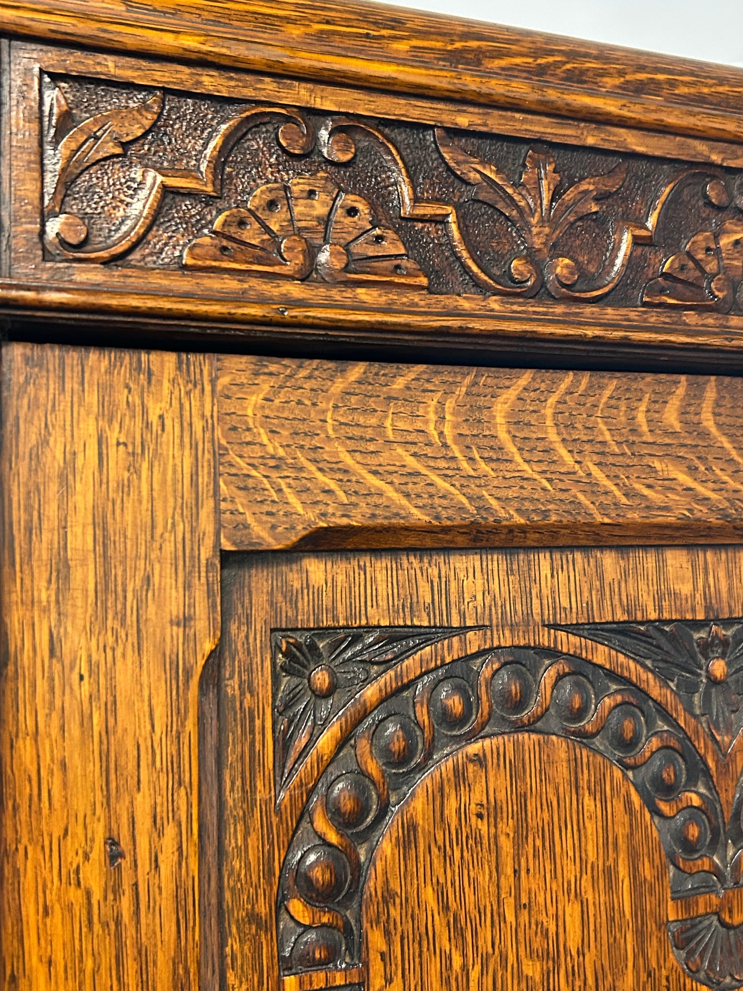 Solid oak 1920s hall robe with linen fold door