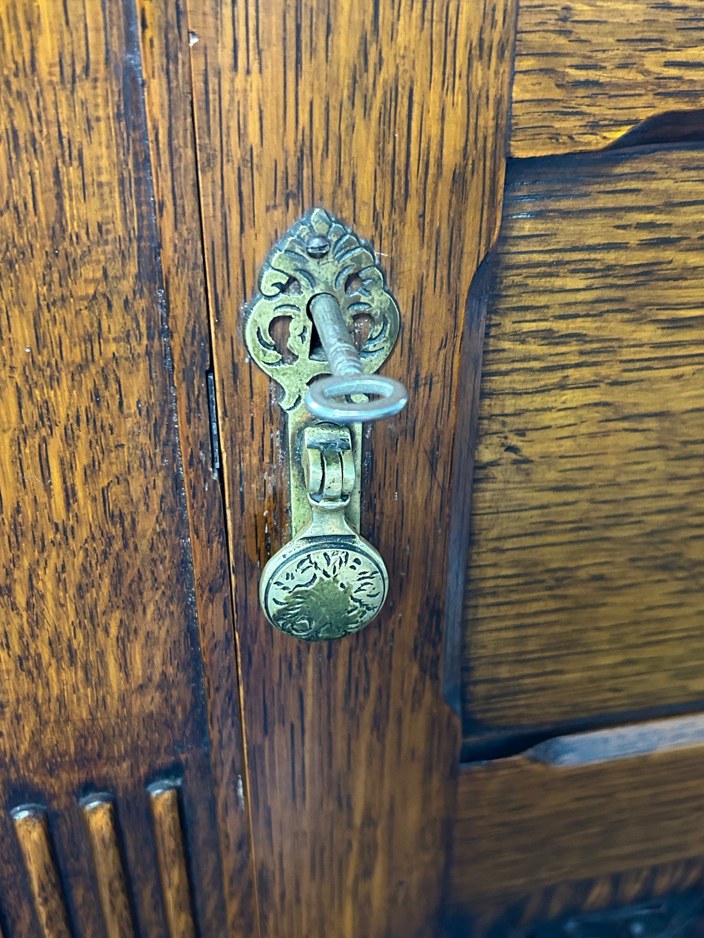 Solid oak 1920s hall robe with linen fold door