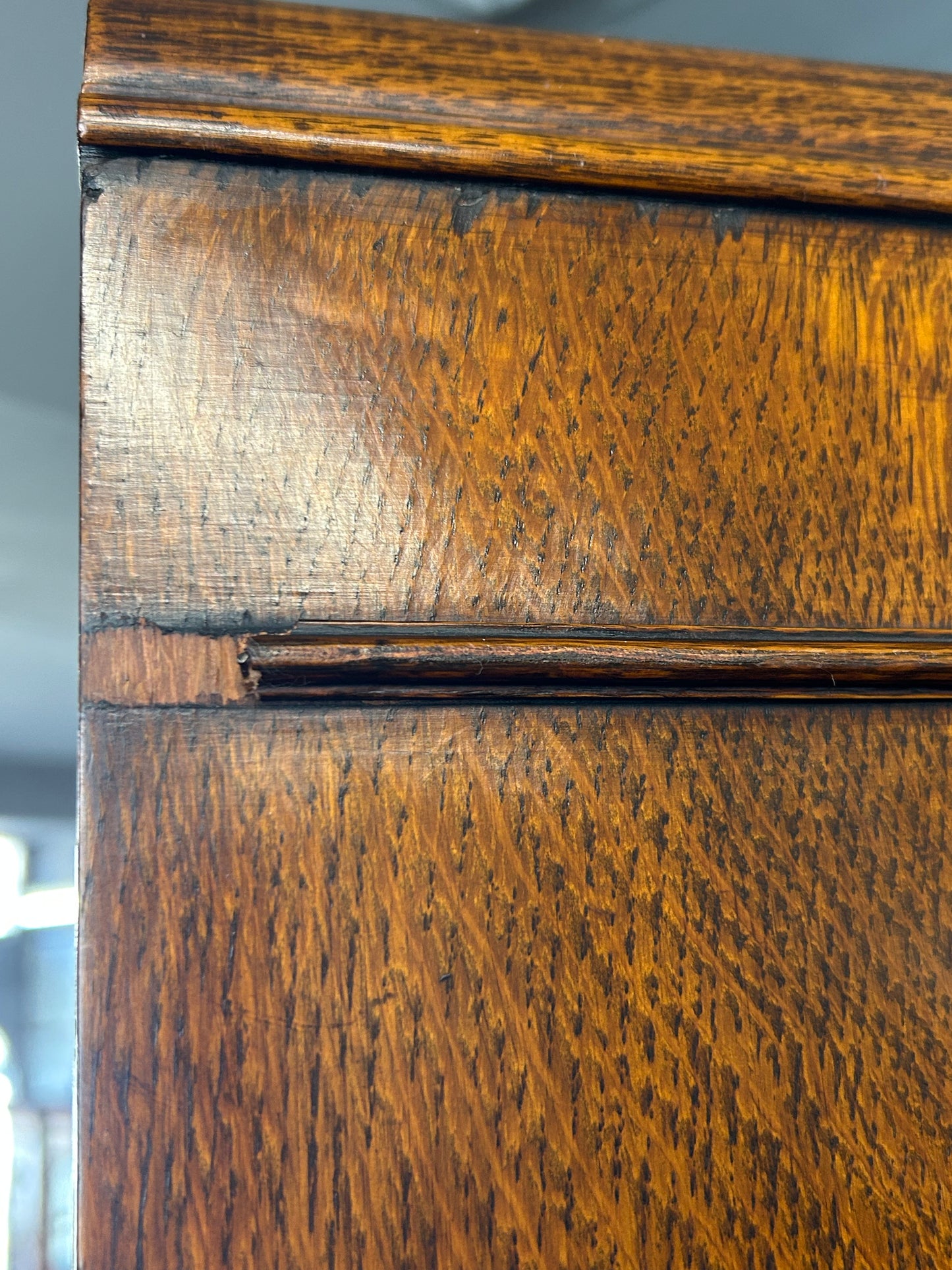 Solid oak 1920s hall robe with linen fold door